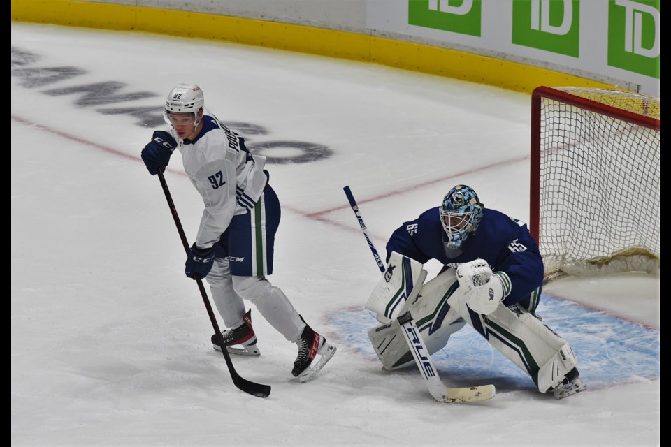 Vasily Podkolzin sets up in front of Mikey DiPietro during a drill at the first day of Canucks rookie camp on September 17, 2021. 