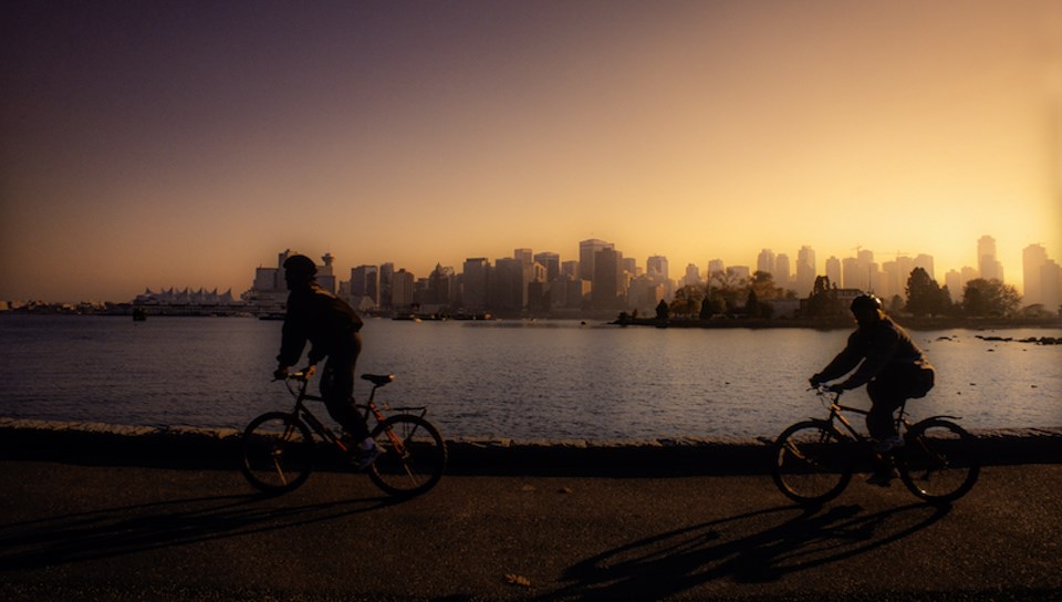 bike-riders-in-vancouver-at-sunset