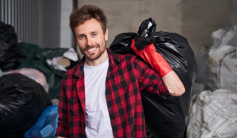 man-smiling-garbage-back