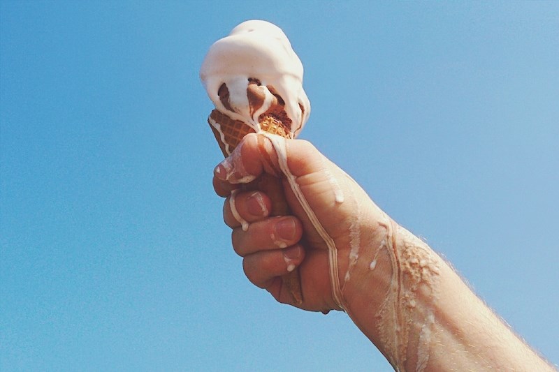 melting-ice-cream-cone-summer-heat-sun-hand