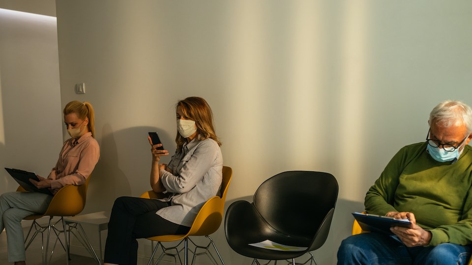 people-waiting-face-masks-hospital-vancouver