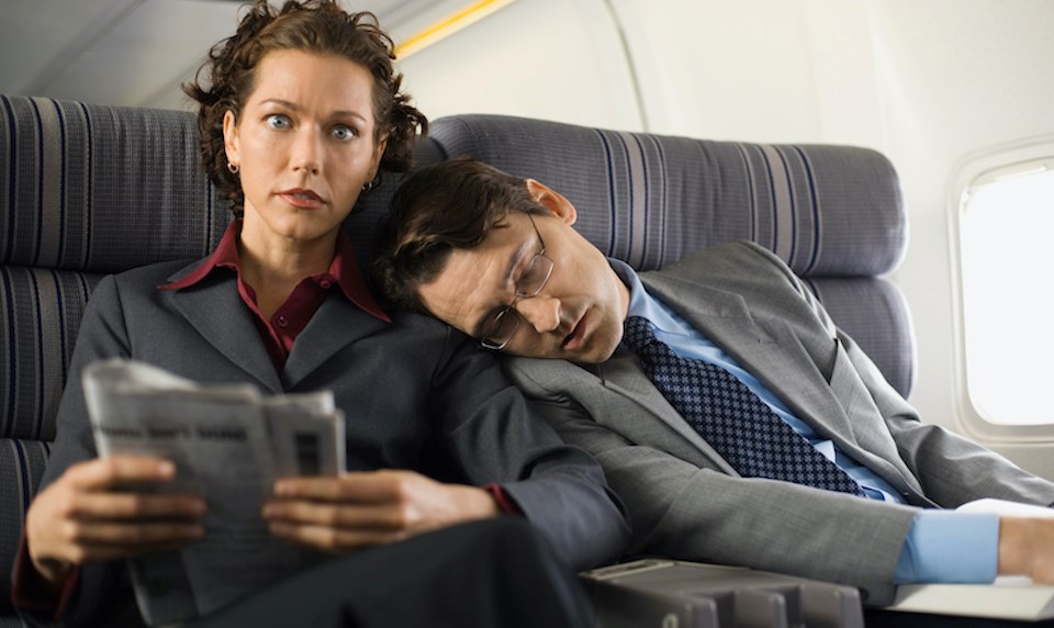 person-falls-asleep-on-another-person-plane