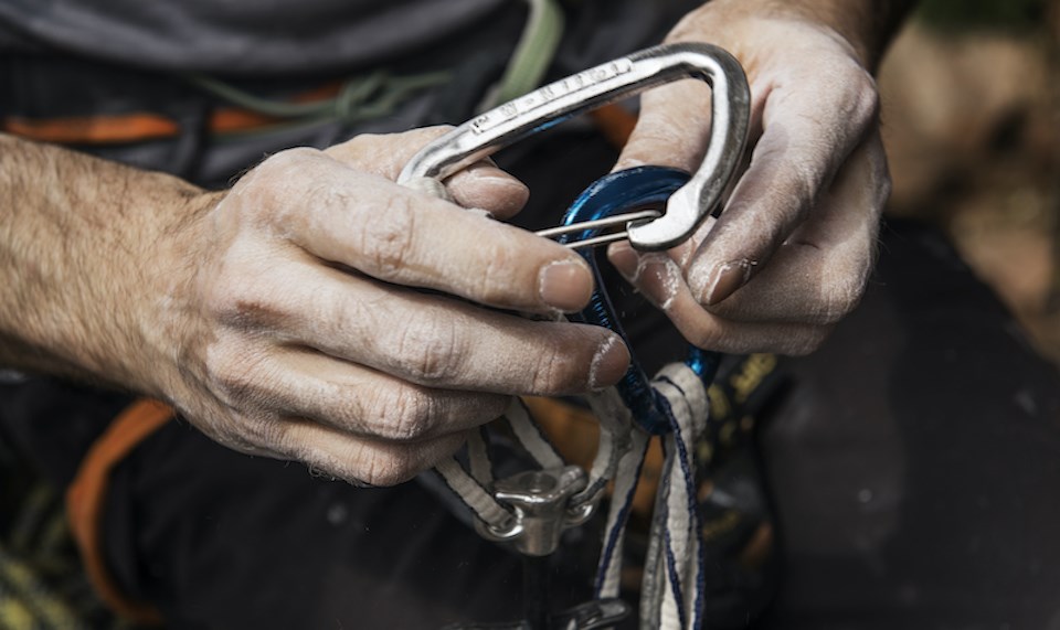 rock-climbing-equipment-mans-hands