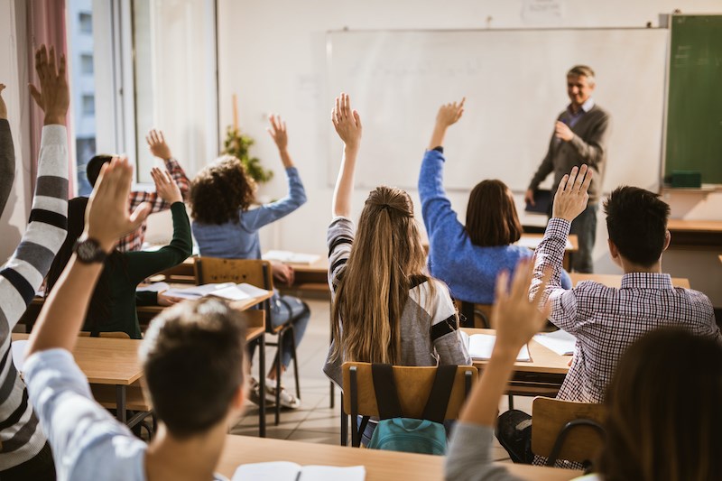 teens-classroom-raised-hands