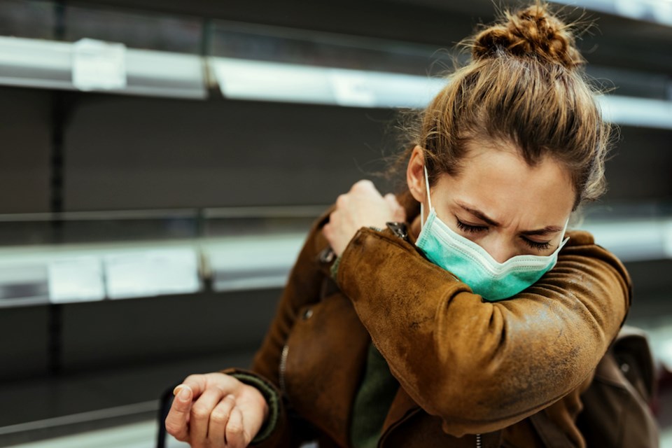 woman-coughing-mask