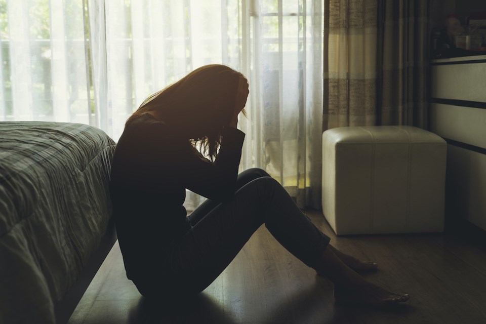 woman-depressed-bedroom-floor