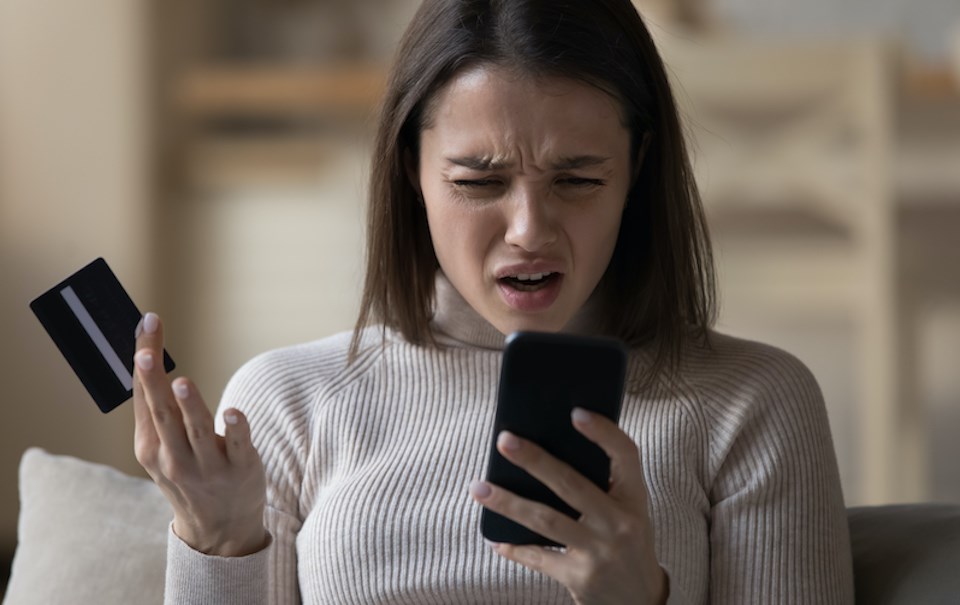 woman-frustrated-phone-credit-card