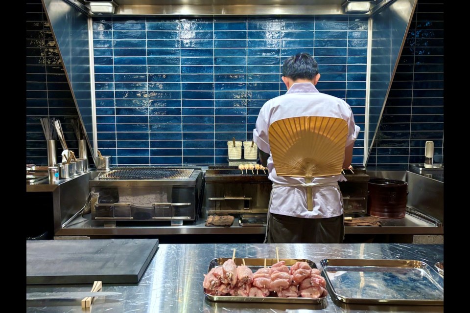 Chef Pete Ho tends to the charcoal grill at his new 鶹ýӳrestaurant Sumibiyaki Arashi, which serves an omakase yakitori (grilled chicken skewer) dinner