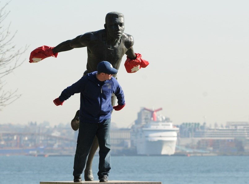 the-harry-jerome-statue-at-stanley-park-adorned-with-the-ubiquitous-red-mitts-photo-dan-toulgoet