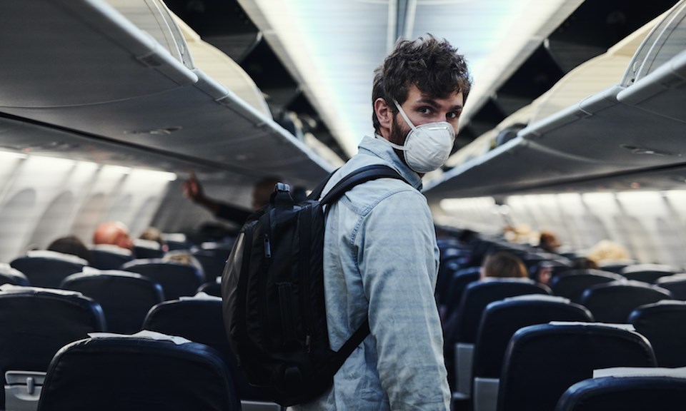 man-wearing-mask-on-plane