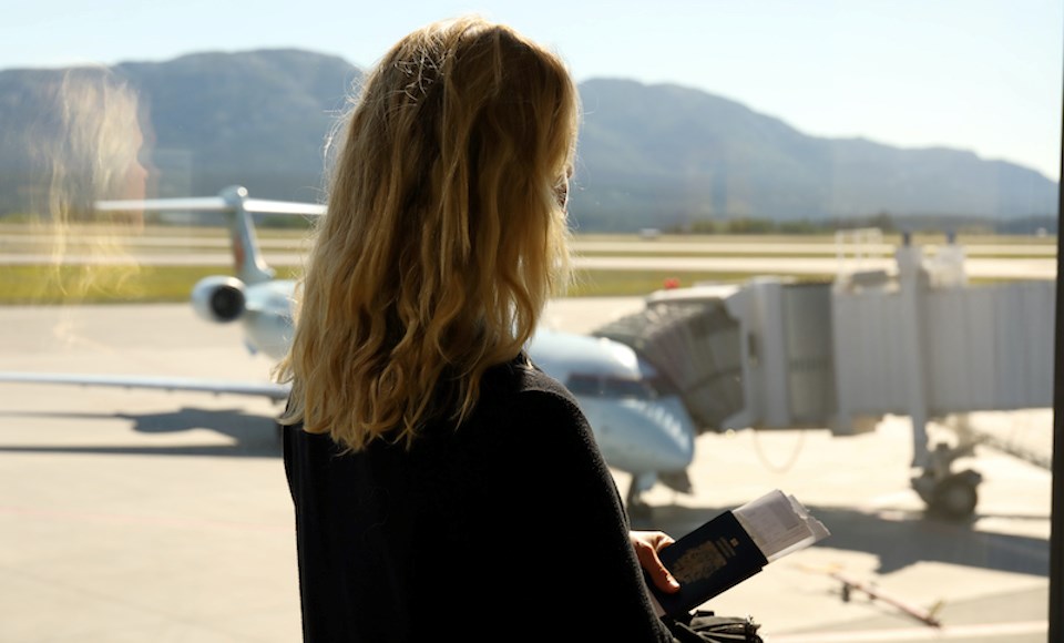 woman-passport-tarmac