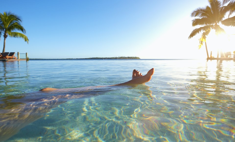 woman-swimming-in-fiji-palm-trees