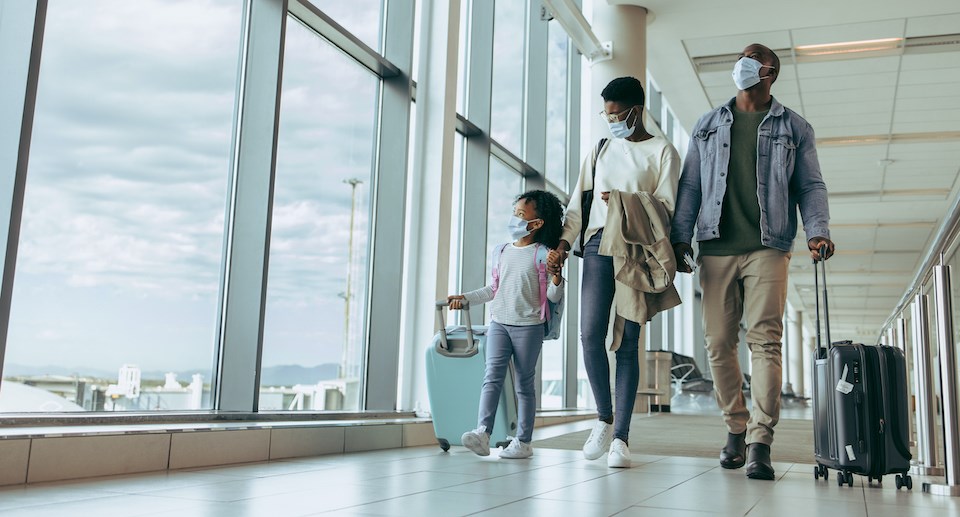 family-walking-with-luggage