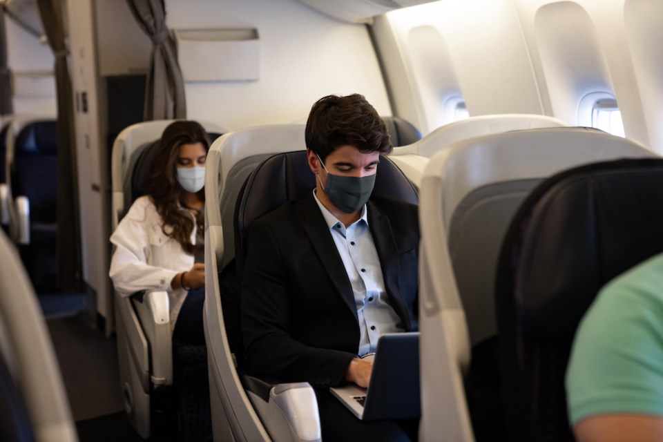 masks plane flying during coronavirus pandemic