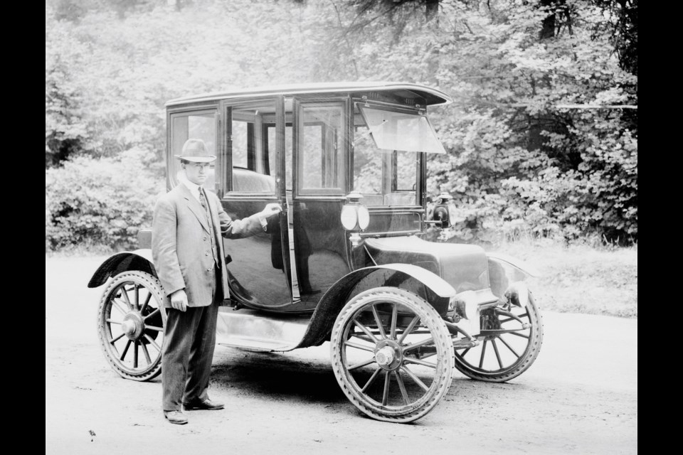 A local man stands beside a coupe around 1913.
Reference code: AM54-S4-: LGN 930