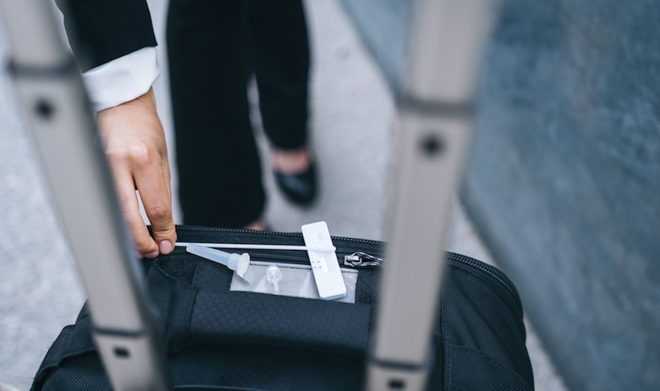 woman-gets-coronavirus-testing-kit-travel