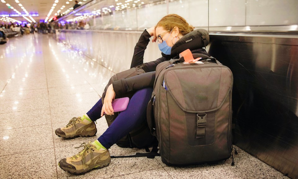 woman-sleeping-waiting-for-flight