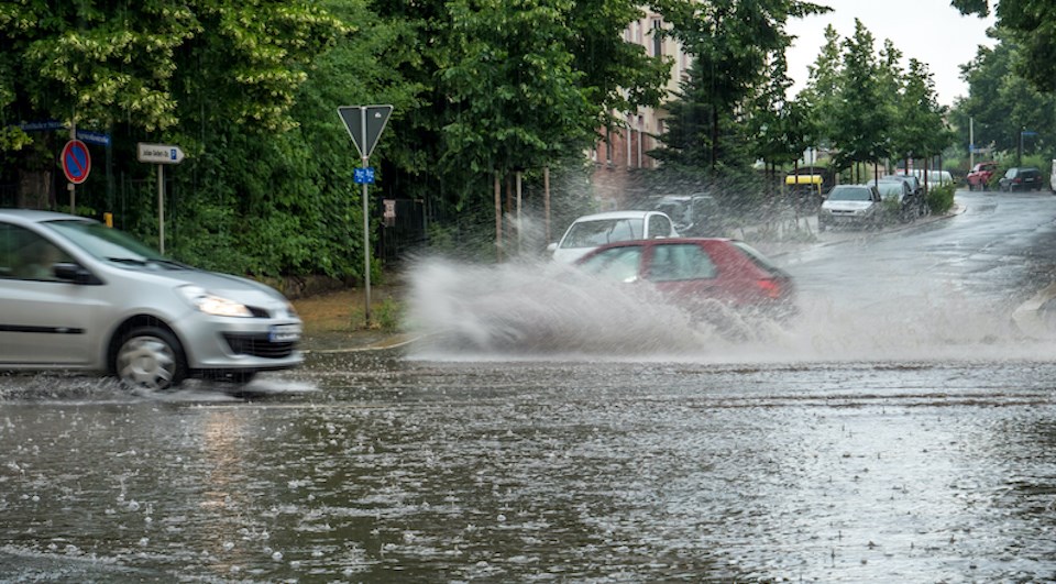 heavy-rain-falls-cars-splash-water