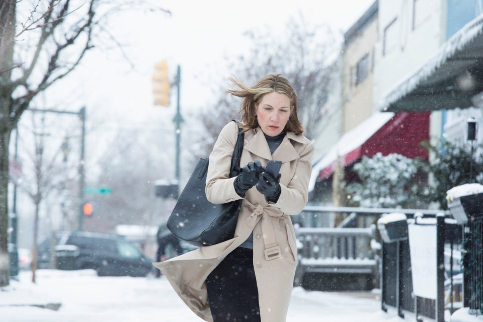 Wind and snow in city