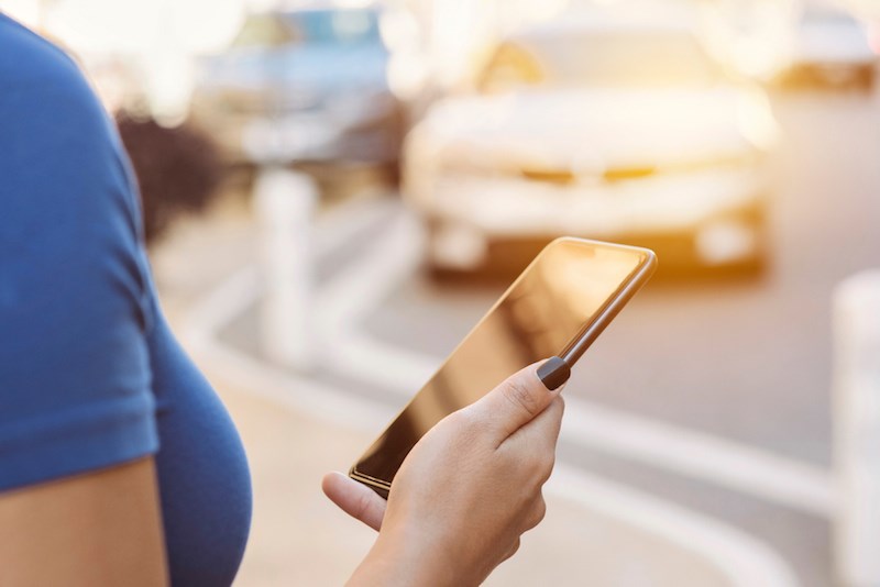 woman-cellphone-waiting-car