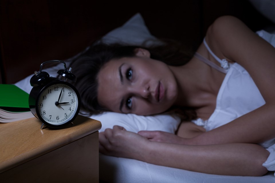 woman-not-sleeping-clock