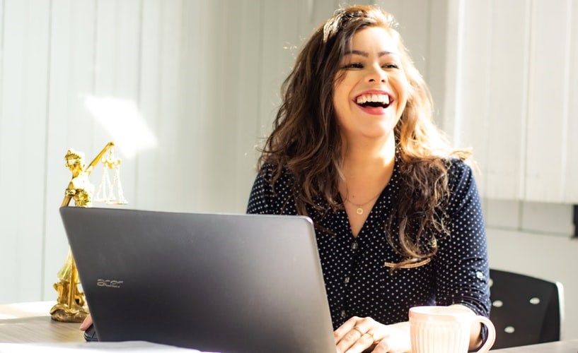 woman-smiling-laptop-unsplash
