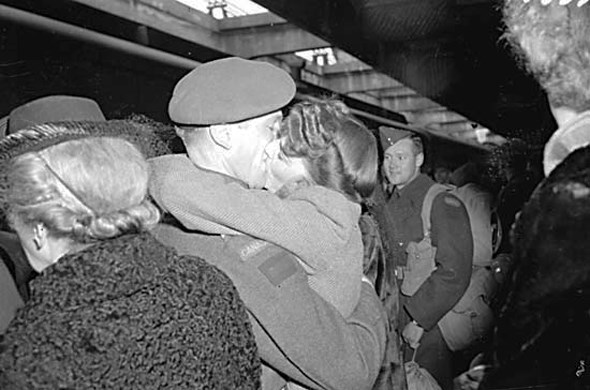 Couple kissing at Vancouver train station, 1944