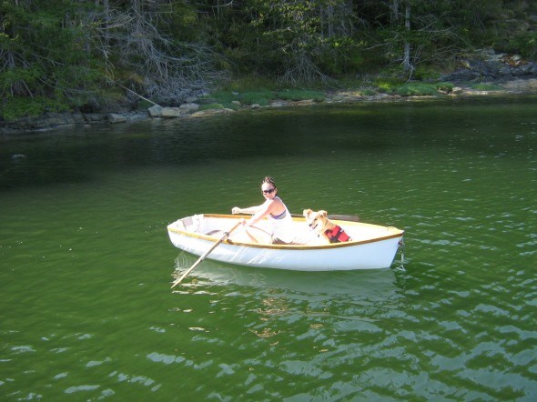 Amber and her dog Mickey in a rowing dingy in Desolation Sound, British Columbia