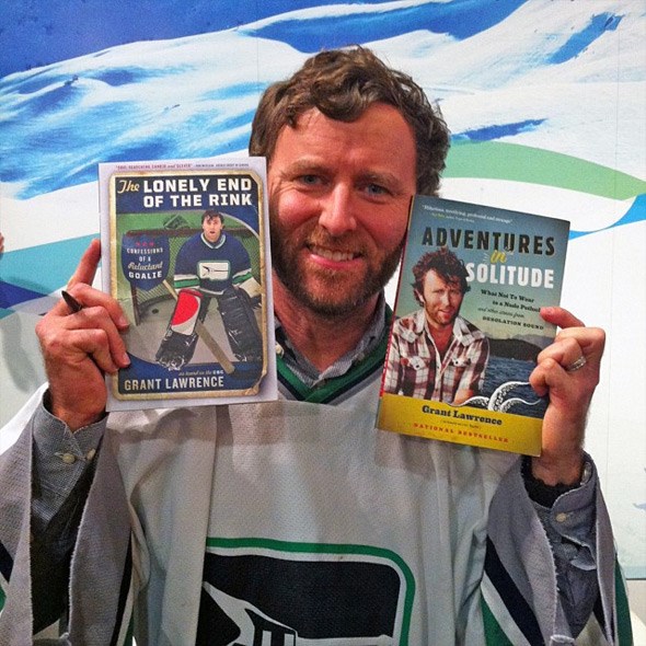  Grant hold copies of his books at the recent release party for The Lonely End of the Rink held at the BC Sports Hall of Fame