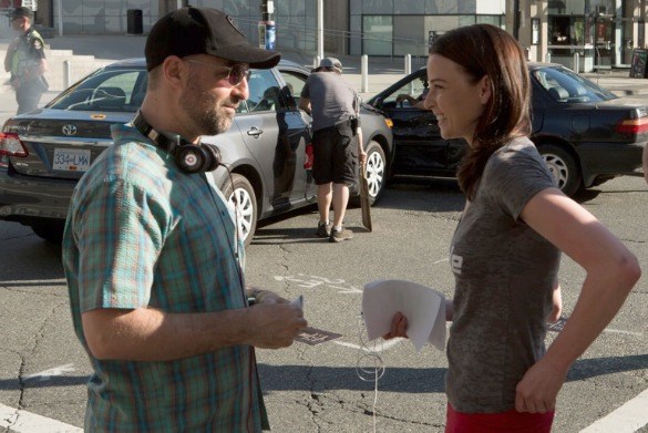  Continuum showrunner Simon Barry directs star Rachel Nichols near B.C. Place.