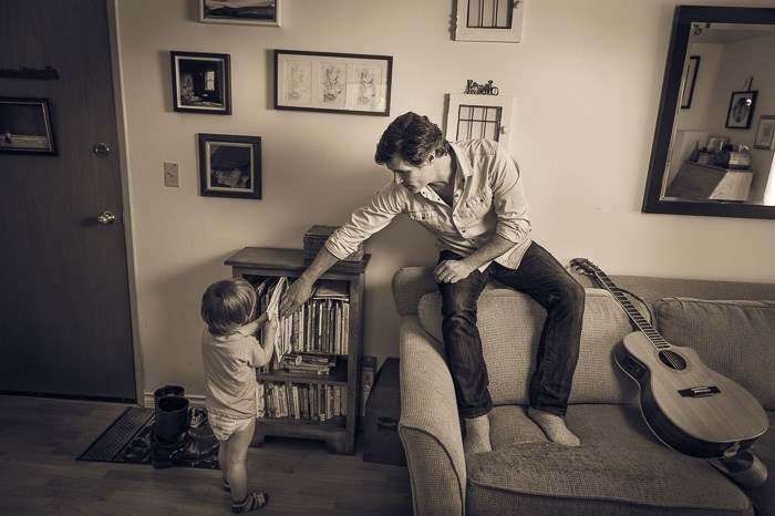  Aaron Grain with son Kailo at home.