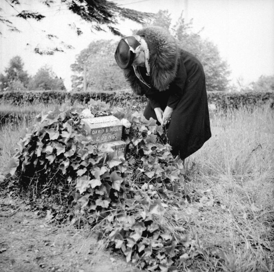  A mother visits her son's gravestone in Mountain View, taken 1939. Major Matthews Collection, CVA Port N137.6