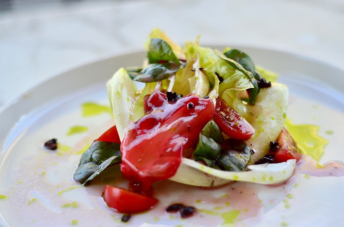  VFV Salad featuring Blue House Organics lettuce, kale, Swiss chard and cherry tomatoes, dressed with cacao nibs, berry scoby (kombucha culture) and chive oil. Salad will change with the crops as the farm heads into fall. Available until mid-October only.