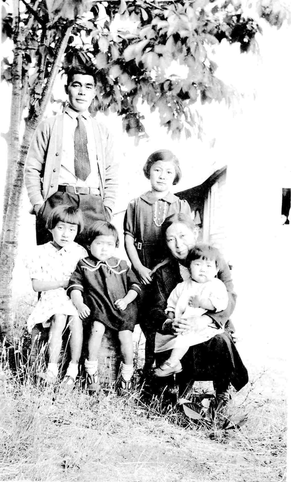 The Murakami family on Saltspring Island, 1938. Father Katsuyori is standing with oldest daughter Alice. Seated from left to right are, Violet, Mary, mother Kimiko and Rose on her lap. Two boys were born later, one in an internment camp in the BC Interior. Photo courtesy of Mary Kitagawa.