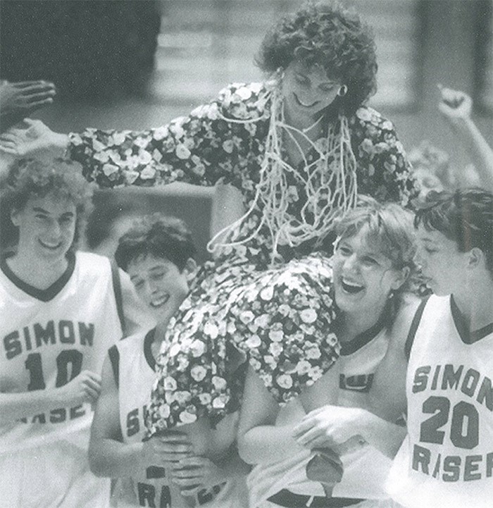  SFU players hoist coach Allison McNeill onto their shoulders after the team secures its first berth into the NAIA national championship in 1990.