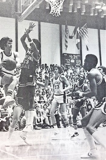  The SFU Clansmen take on the Portland State Vikings in NAIA basketball action in 1977. SFU's nickname was emblazoned on the front of the team's uniform that year. - SFU archives