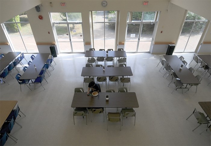  A Capilano student enjoys the butter chicken curry at the popular residence dining hall. photo Mike Wakefield, North Shore News