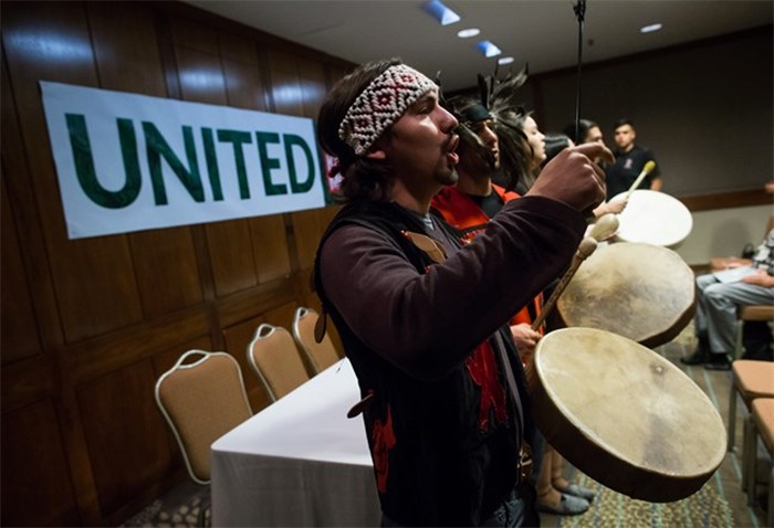  Swo Wo Gabriel, of the Squamish First Nation, sings and plays a drum before First Nations and environmental groups speak about a federal court hearing about the Kinder Morgan Trans Mountain pipeline expansion, during a news conference in Vancouver, B.C., on Monday October 2, 2017. The hearing which began Monday consolidates numerous lawsuits filed by seven First Nations applicants, the cities of Burnaby and Vancouver, the Raincoast Conservation Foundation, and the Living Oceans Society, which claim the National Energy BoardÕs approval process was flawed and First Nations werenÕt adequately consulted. THE CANADIAN PRESS/Darryl Dyck