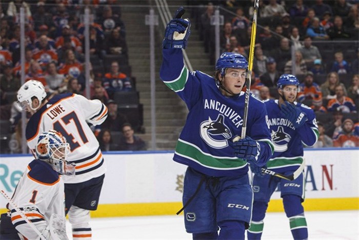  Vancouver Canucks' Jake Virtanen (18) celebrates a goal on Edmonton Oilers' goalie Laurent Brossoit (1) during first period pre-season NHL action in Edmonton, Alta., on Friday September 22, 2017. Brock Boeser spent some nervous days in his hotel room, wondering if he had done enough in training camp and pre-season to stick with the Vancouver Canucks. Virtanen only realized he made the team after seeing the hockey bag of the player he was battling for a spot packed and ready to be shipped off to the minors. THE CANADIAN PRESS/Jason Franson