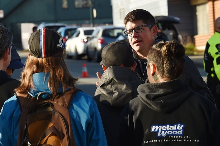  While firefighters continued to deal with the fire that destroyed Metal and Wood Products on Wednesday morning, Peter Spotzl met with his staff on the street. He hopes to have the business up and running as soon as possible.