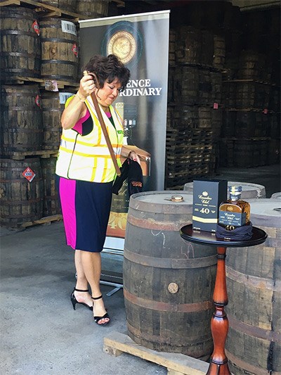  Tish Harcus, global brand ambassador, draws the first drops of Canadian Club 40 Year Old whisky from the barrel. - Joanne Sasvari photo