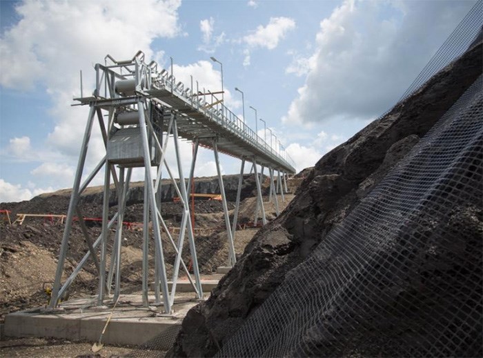  Roller compacted concrete conveyor construction at the south bank in June 2017.   Photo By BC Hydro