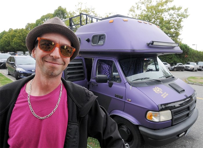  RV life ambassador Justin Credible poses with his purple ride and full-time home parked on a North Vancouver side street. photo Mike Wakefield, North Shore News