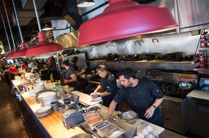  Line cooks Ishaan Kohli, front right, and Abrahan Ruiz, centre, work in the kitchen at Edible Canada restaurant in Vancouver, B.C., on Wednesday October 11, 2017. The restaurant industry may be booming in British Columbia, but a combination of the high cost of living, tight profit margins and a shrinking workforce has made it difficult for kitchens to find enough staff. THE CANADIAN PRESS/Darryl Dyck