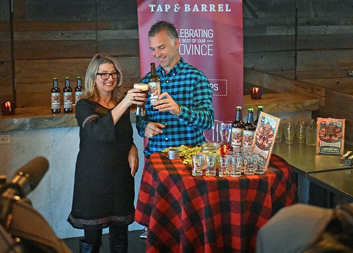  MLA Lana Popham and Matt Phillips raise a glass of lumberjacked