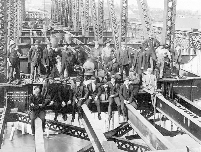  Steel workers taking a break during construction of the second bridge, 1909. Archives# CVA 1376-453.