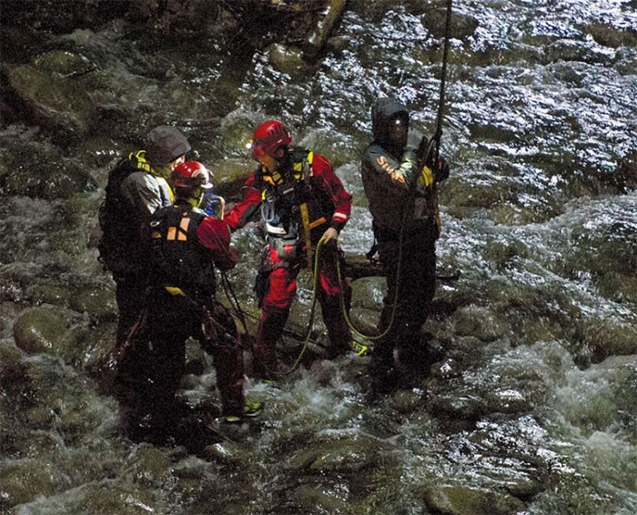  A high angle rescue is used to rescue four anglers trapped on an island in the Capilano River under the Highway 1 bridge in North Vancouver at nightfall on Wednesday. photo supplied Gerry Kahrmann/PNG