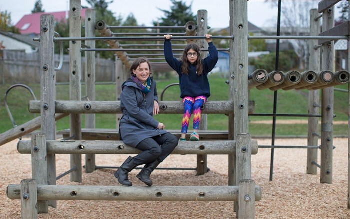  Aaren Madden, with daughter Lily Walsh, 9, says government help would even the playing field between schools. Photograph By ADRIAN LAM, Times Colonist