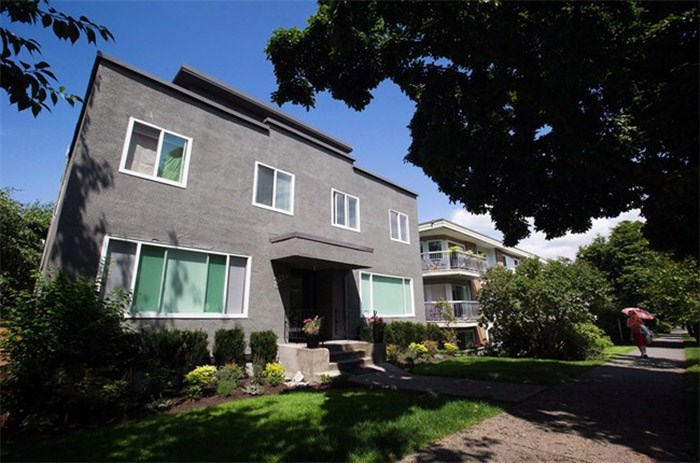  A woman walks past a 29-unit apartment building that reportedly has 17 Airbnb listings, in Vancouver, B.C., on Wednesday July 6, 2016. As Canadian cities continue to wage a regulatory crack down on online home-rental platforms, Airbnb maintains it's open to regulation provided new rules don't penalize casual users and recognize not every host runs a full-fledged business.THE CANADIAN PRESS/Darryl Dyck