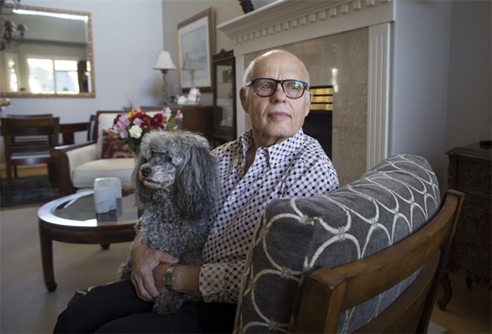  Max Morton, 81, sits with his dog Barney at his home in Richmond, B.C., on Monday October 30, 2017. Morton is one of 411 patients who had transcatheter aortic valve replacement surgery where the damaged aortic valve is replaced without removing the old one. The procedure is an alternative to the more invasive open-heart surgery. THE CANADIAN PRESS/Darryl Dyck
